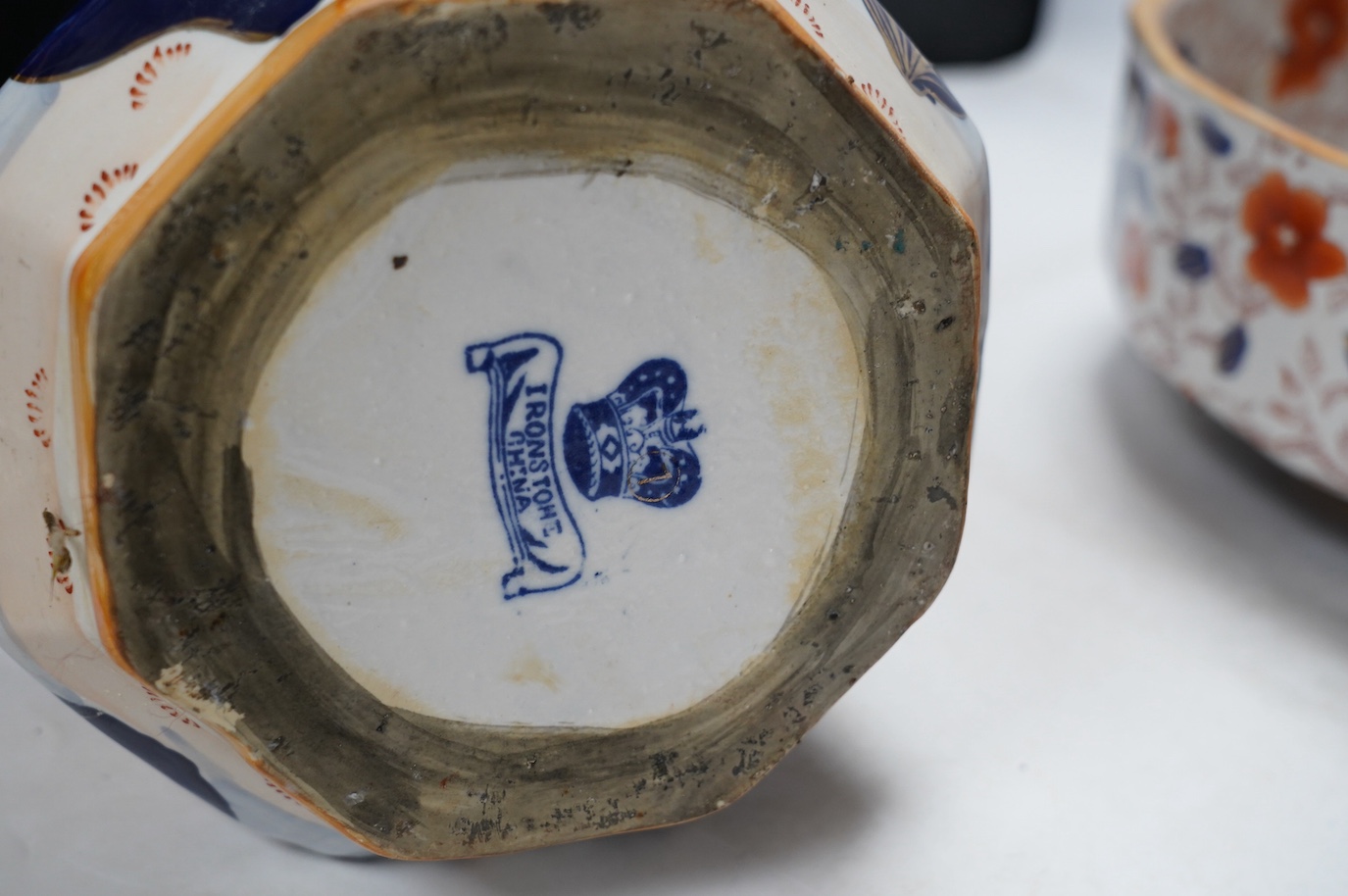 An ironstone style Hydra jug and bowl, together with two Royal Crown Derby dinner plates, jug 28cm high. Condition - poor